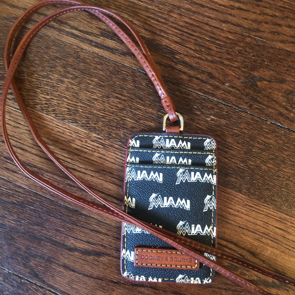 Dooney and Bourke Lanyard ID badge Wallet. 

Black